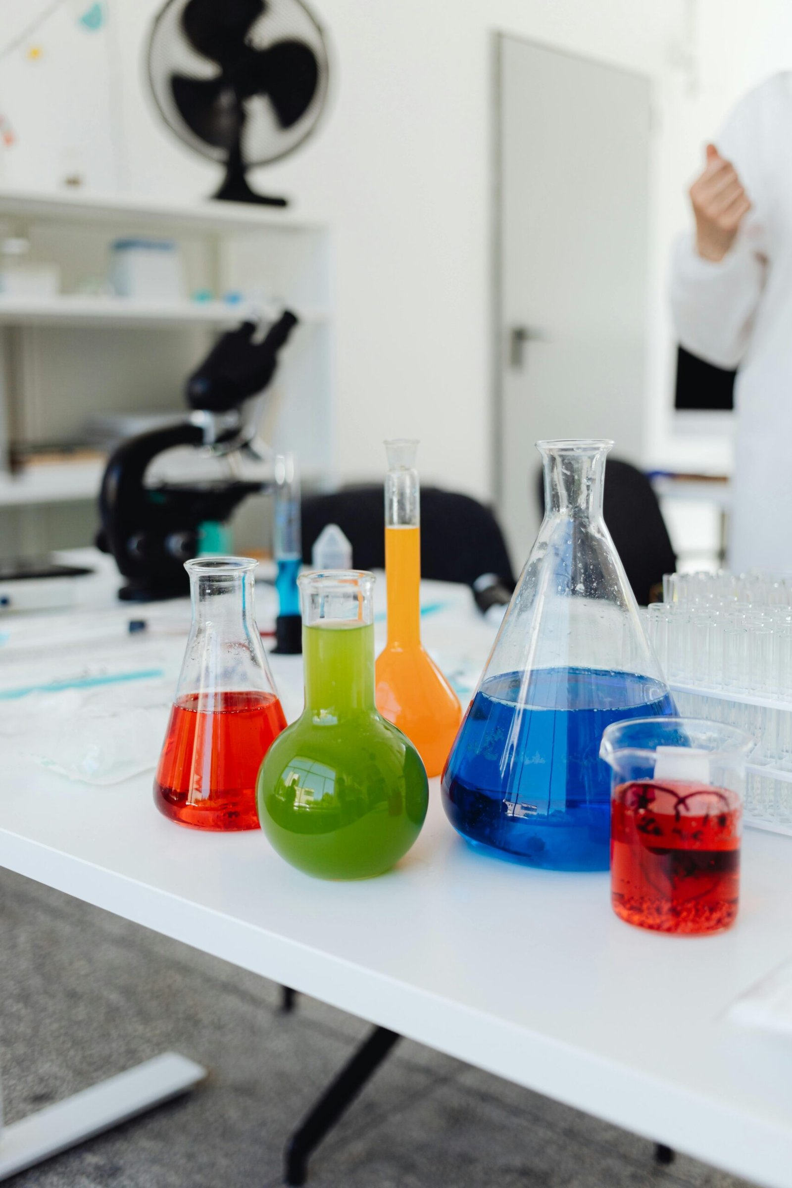 A vibrant display of colored liquids in glassware during a laboratory experiment.